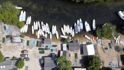 Aerial view of the mangrove forest on Junggut Batu, Nusa Lembongan. There are several fisherman's houses around there. White sand beach with pristine seawater. Mangroves look thick and healthy