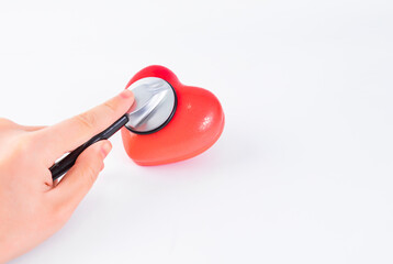 stethoscope and heart on blue background