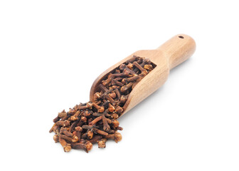 Aromatic dry cloves spice closeup in wooden measuring scoop isolated on white background