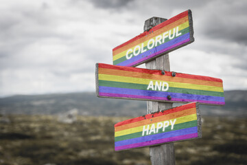 colorful and happy text quote on wooden signpost crossroad outdoors in nature. Freedom and lgbtq community concept.