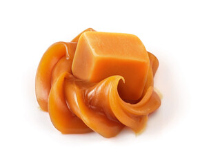 Soft caramel swirl with caramel cube isolated on white background. Caramel sauce.