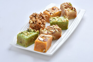 Mix Halwa, A delicious collection of different healthy traditional sweets, made by desi ghee (butter oil), dry fruits and milk.