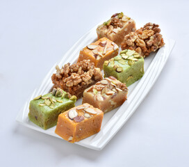 Mix Halwa, A delicious collection of different healthy traditional sweets, made by desi ghee (butter oil), dry fruits and milk.