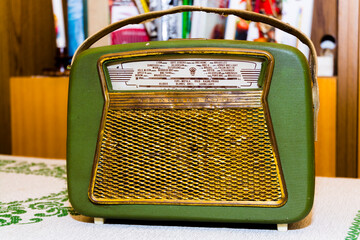 Very old radio in a room with books