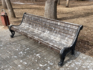 bird droppings on a bench in a park or street, as a symbol of the poor performance of urban...