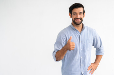 Nice smile friendly Cauasian man in blue shirt giving thumbs up on white background