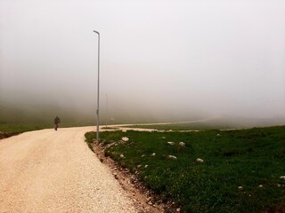 Mountain biking in the fog on mountain Jahorina, Bosnia and Herzegovina