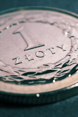 Translation: 1 zloty. Fragment of Polish one zloty coin closeup. National currency of Poland. Tinted vertical illustration for news about banking or finance. Macro