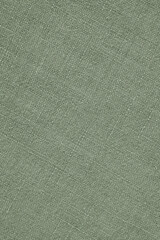 Fototapeta na wymiar Light green woven surface close-up. Linen textile texture. Fabric handicraft background. Pale textured braided backdrop. Len gray-green vertical wallpaper. Macro