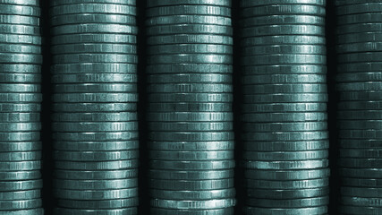 Stacks of coins close up. Coin texture. Blue-green business background made of many coin edges. Economy finance and bank wallpaper. Money wall. Macro
