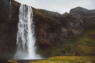 Waterfall in Iceland mountain greenery