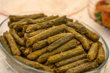 delicious stuffed leaves in glass plate on table