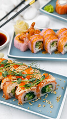 Japanese cuisine. Rolls with salmon on a white table.
