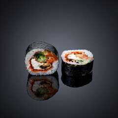 Japanese cuisine. Dishes on a black, glossy table
