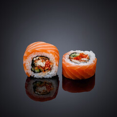 Japanese cuisine. Dishes on a black, glossy table
