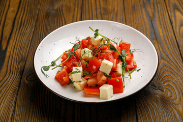 European cuisine. salad on a wooden table
