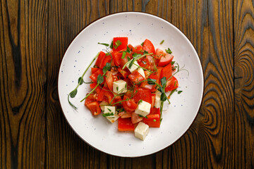 European cuisine. salad on a wooden table
