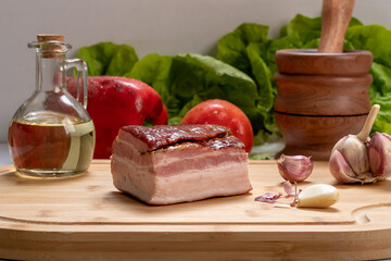 piece of bacon on a wooden board, ingredient, gastronomy,  preparation food
