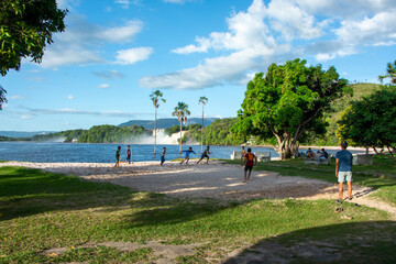 Indigenous children playing soccer on the shore of the Canaima lagoon