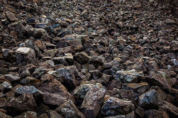 Texture of natural gravel. Background with stones and rocks in brown toning.