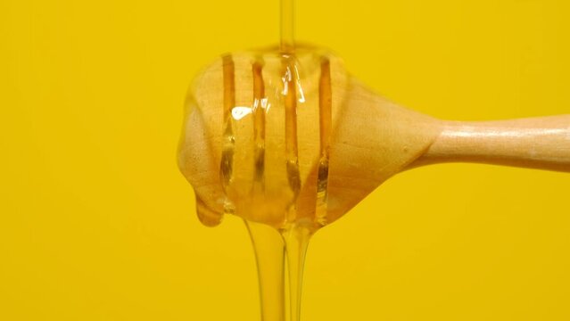 honey dripping from a spoon