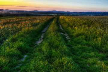 Fototapeta premium Sunrise over the road in the Little Beskids