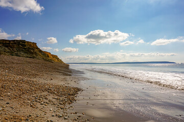 Coastal landscape in the south coast of England. sea view from beach with eroded cliffs 