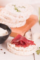 Rice cakes with milk flakes and cold beef.