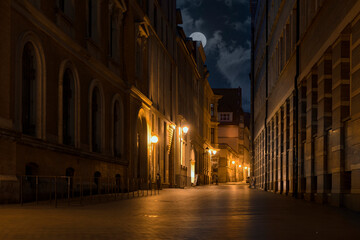 Fototapeta na wymiar Night street of the old European city of Halle (Saale) in Germany.