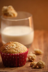 tasty breakfast or healthy snack, with muffins and glass of milk, pieces of muffin scattered