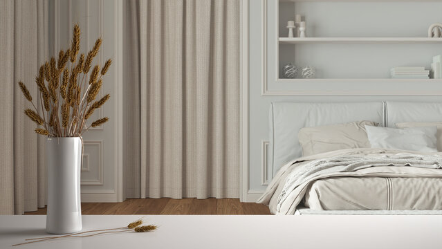 White table top or shelf with straws, dry plants, ornament, ears, sheaf, branch in vase, over classic bedroom with double bed close up, classic minimal interior design