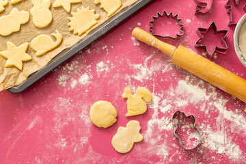 Fototapeta na wymiar baking christmas cookies. baking cookies with cut shapes.