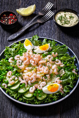 pink cocktail shrimps salad with veggies and eggs
