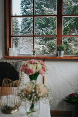 Snowy winter mountain in a cozy hut window view