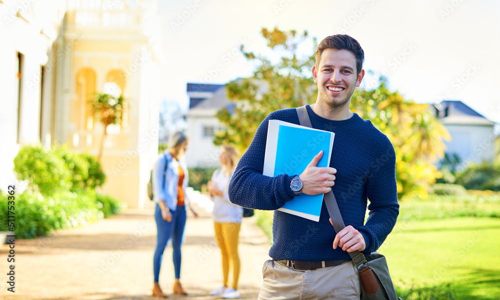 Poster my assignment is done, now to hand it in. portrait of a male university student outside on campus.