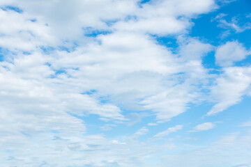 Fototapeta premium Blue bright sky with clouds. Nature background template with copy space