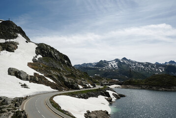 A picture of Grimsel Pass of Switzerland road and dam. The Grimsel Pass is a mountain pass in...