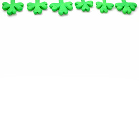 decorative frame of green clover made of plasticine on white background