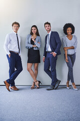 Theyre a team built to last. Portrait of a diverse group of businesspeople standing against a grey background.