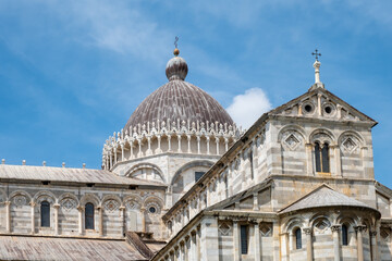 Architectural details of the exterior of the Pisa Cathedral in Pisa, Italy with negative space for copy.