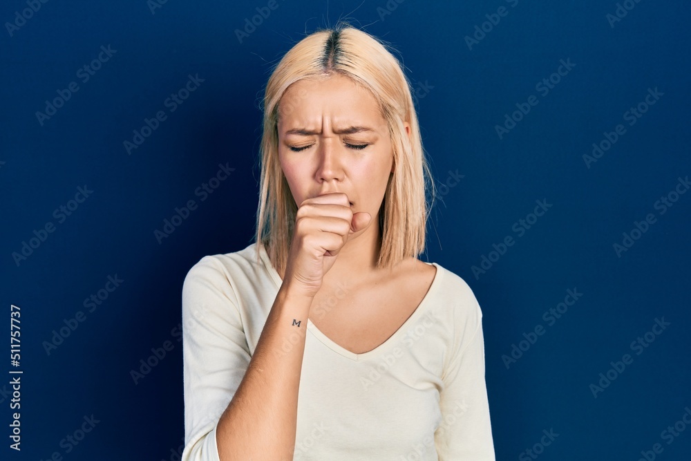 Sticker beautiful blonde woman wearing casual sweater feeling unwell and coughing as symptom for cold or bro