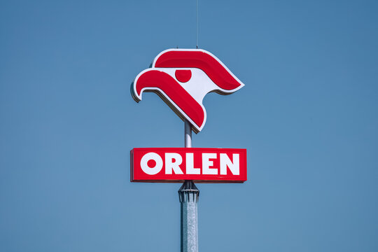 Pniewy, Poland - June 18, 2022. PKN Orlen logo with a blue sky background. Orlen is a state-owned oil refiner and the largest petrol retailer in Poland.