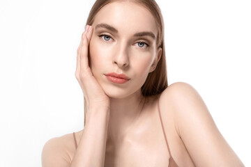 A beautiful young woman with clear soft skin, blue eyes, and natural makeup looks at the camera with tenderness