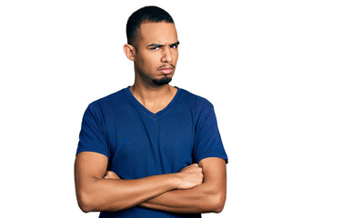Young african american man with arms crossed gesture skeptic and nervous, frowning upset because of problem. negative person.