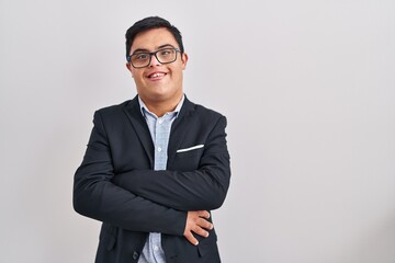 Young hispanic man with down syndrome wearing business style happy face smiling with crossed arms...