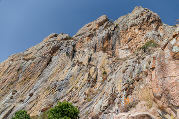 golden monolith and blue sky in the background