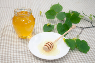 Natural linden honey with linden flowers