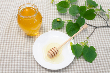 Natural linden honey with linden flowers