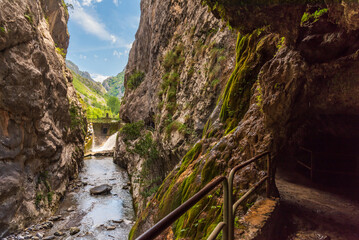 Path of the Cares river, road built in the rock based on tunnels, next to the Cain dam. Picos de Europa.