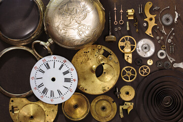 Vintage pocket watch clockwork mechanism parts. Detail of clock parts for restoration